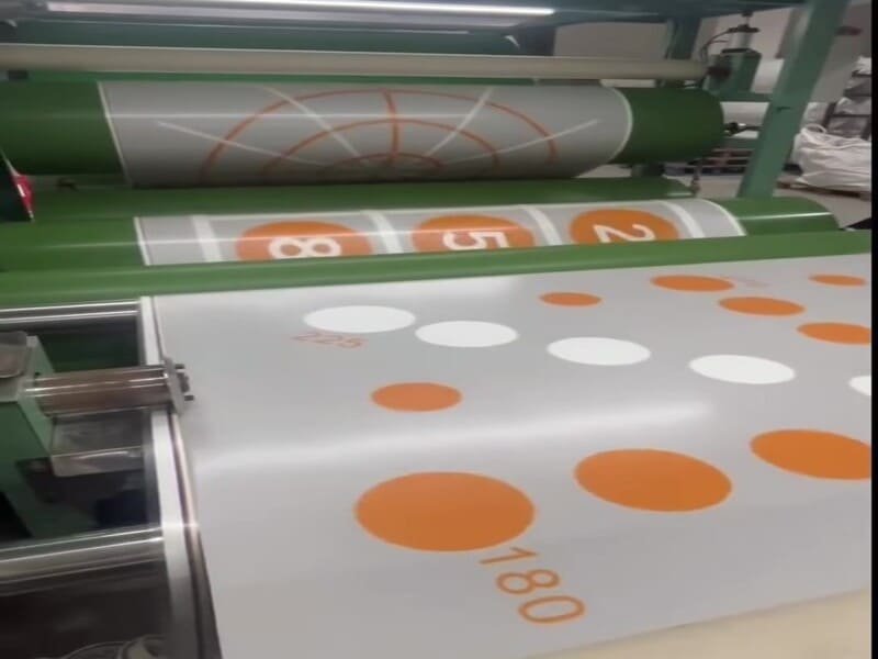 Quality control inspector checking PVC sports flooring thickness in factory